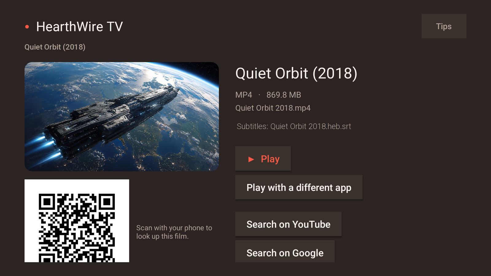 A film's page on the television: large still, file name and size, the subtitle file found beside it, a Play button, Play with a different app, and a QR code to look the film up on a phone
